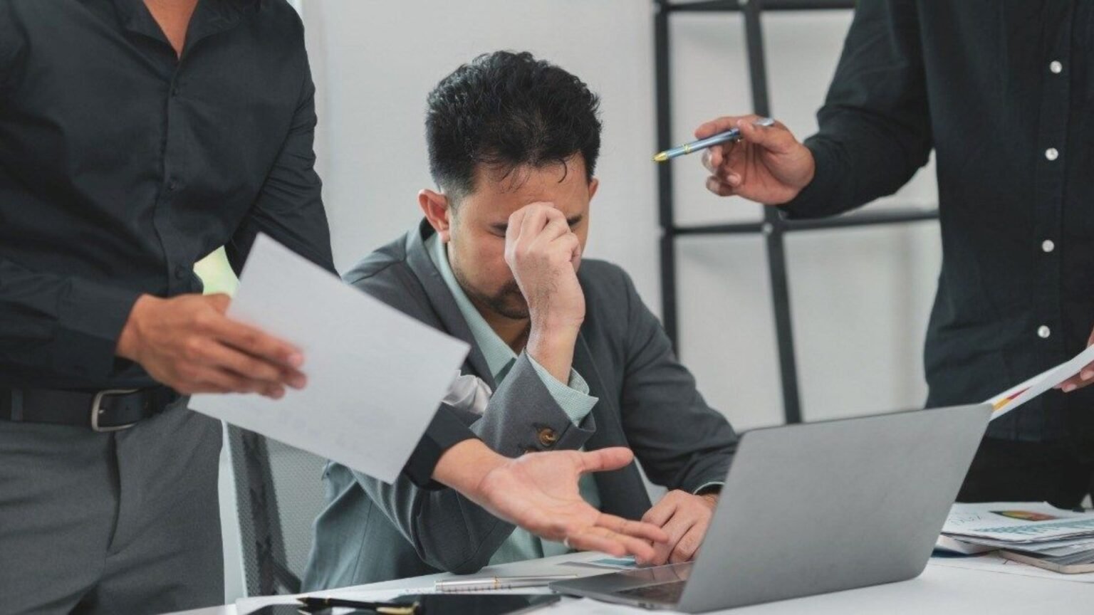 Workplace toughness shown by a leader guiding a team through a demanding discussion with clarity, discipline and respect