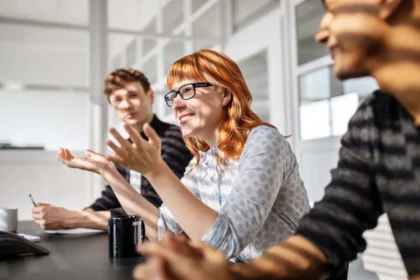 Emotional intelligence helping colleagues manage defensiveness and communicate constructively during a difficult workplace conversation.