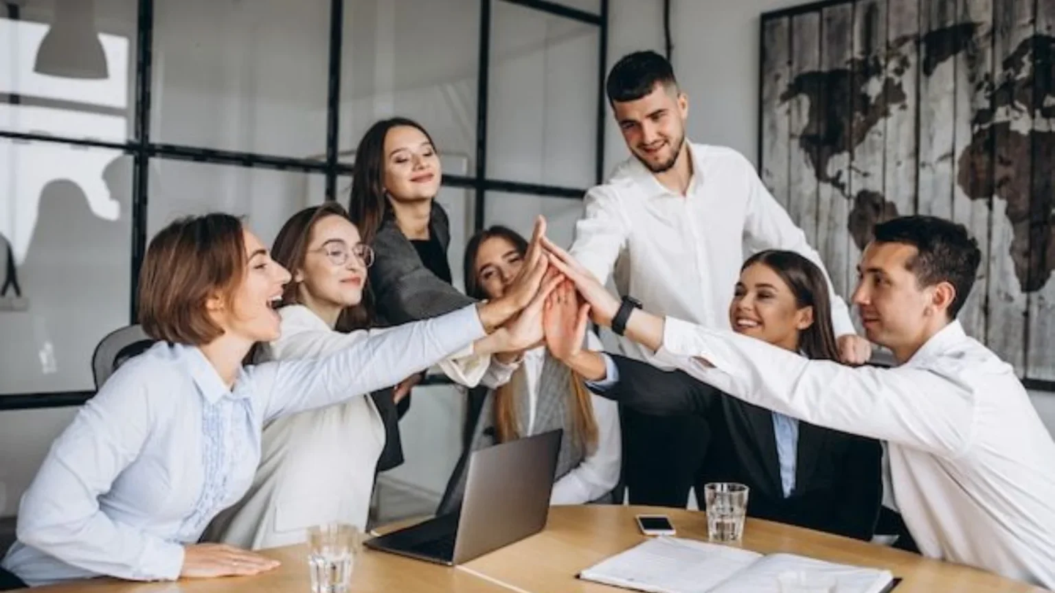 Manager discussing priorities with remaining employees to rebuild team confidence after layoffs.